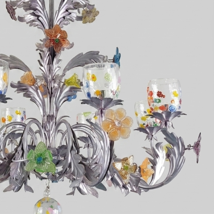 Detail of a Murano glass chandelier with floral ornaments in pastel coloured glass on a silver frame